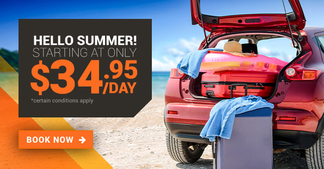 It's summer time vacay in a red car on a beach