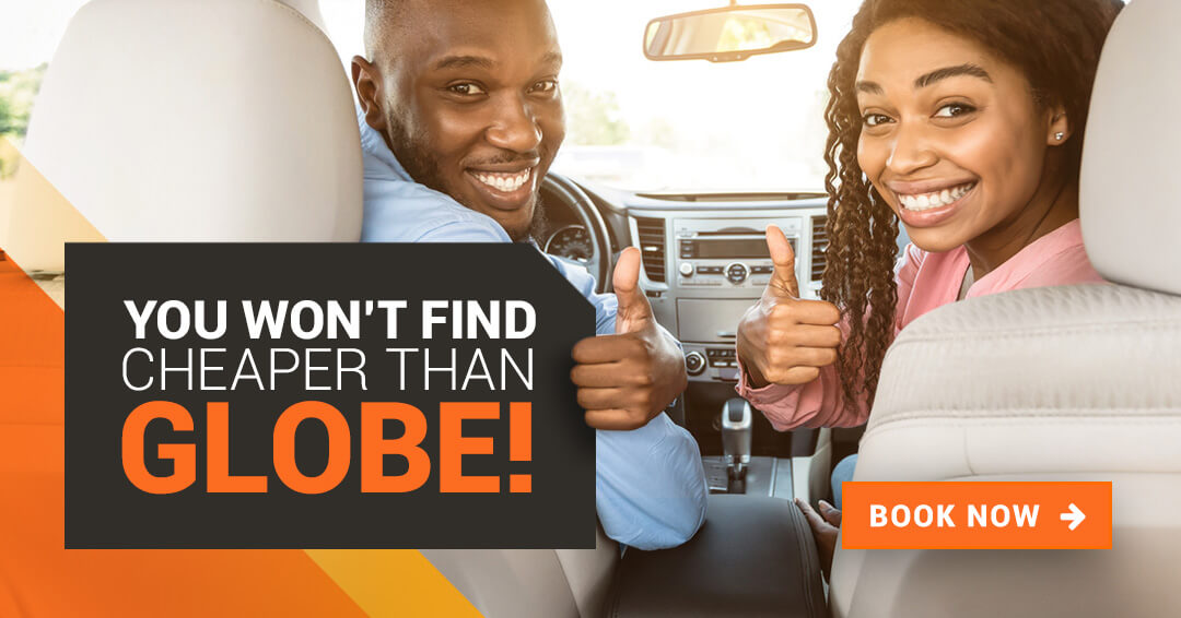 happy couple smiling in a car thumb up