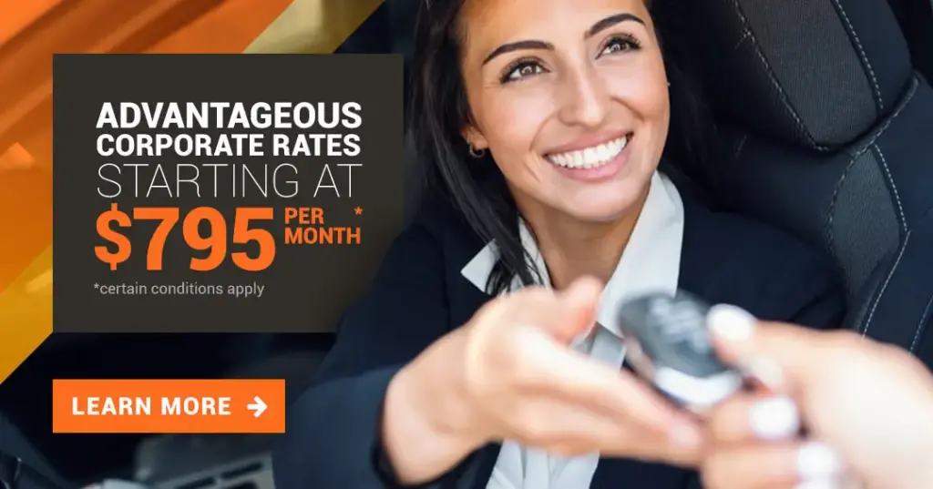 Happy women smiling with a car key