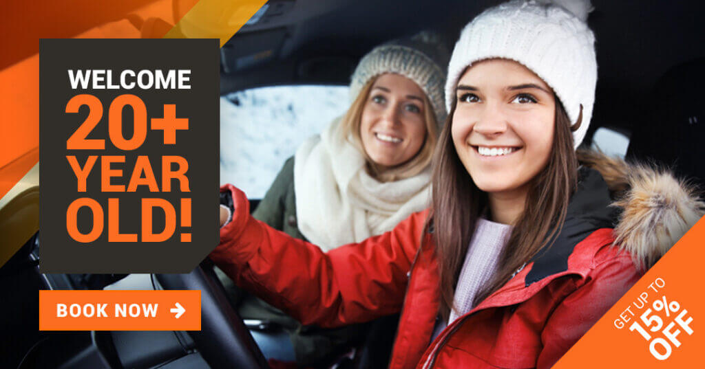 Mom with her daughter in the car in winter in coat and toque